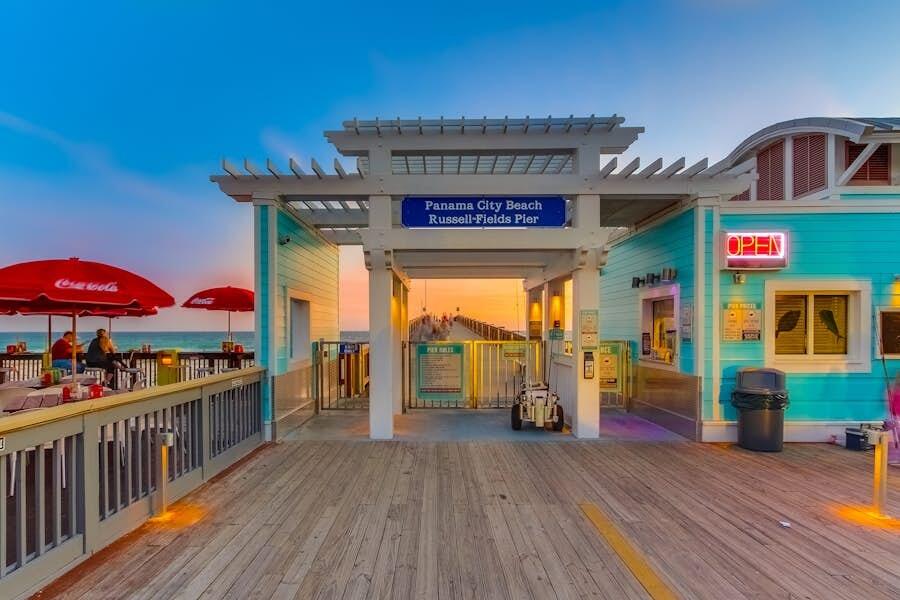 16819 Front Beach Road, Unit 602 Panama City Beach, FL 32413 - Photo 52 of 53 a view of a cafe with furniture wooden floor and a fireplace