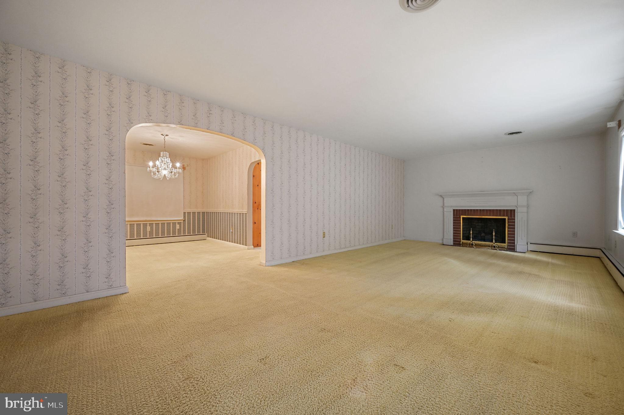 55 Boyd Circle Dover, DE 19901 - Photo 11 of 24 a view of an empty room with a fireplace and a window
