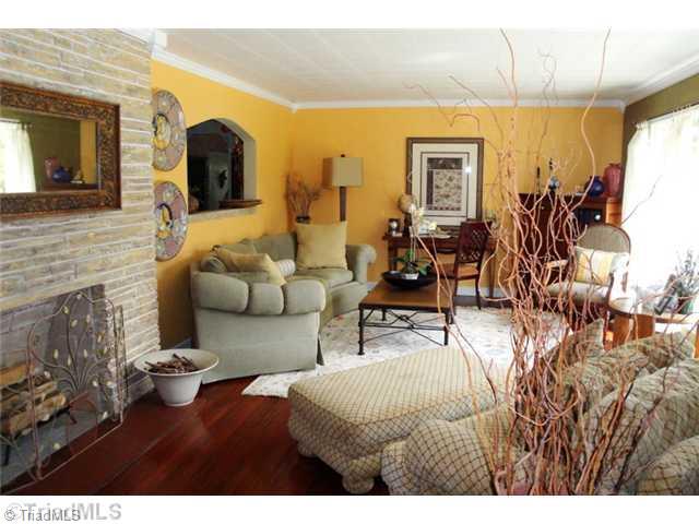 706 Rockspring Road High Point, NC 27262 - Photo 2 of 16 Living Room. With the wall of windows, this room is awash with light...beautiful stone fireplace anchors the room
