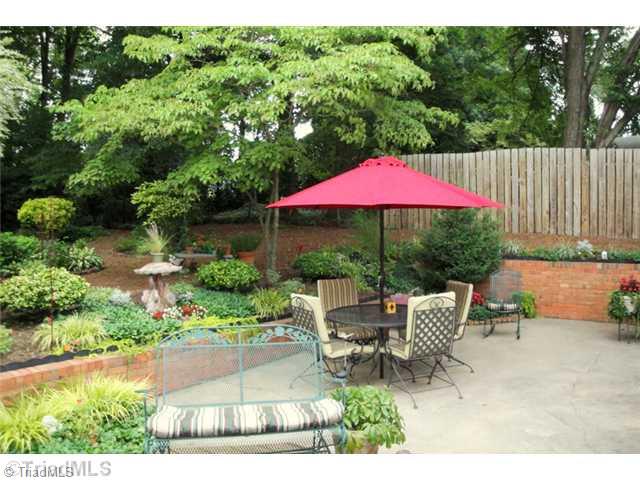 706 Rockspring Road High Point, NC 27262 - Photo 12 of 16 Exterior Back. You can relax on the deck or dine out on the patio...either way you will enjoy the views of this incredible yard!!!