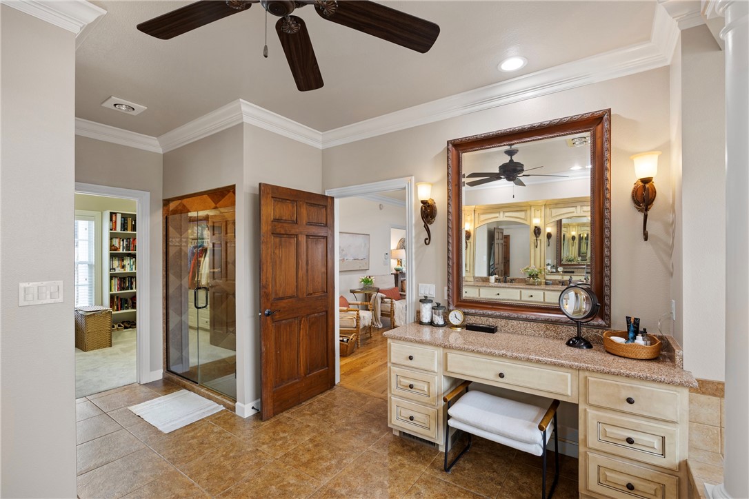 788 Cliff Road Russellville, AR 72802 - Photo 25 of 60 Ensuite bathroom featuring ornamental molding, a stall shower, ceiling fan, vanity, and light tile patterned floors