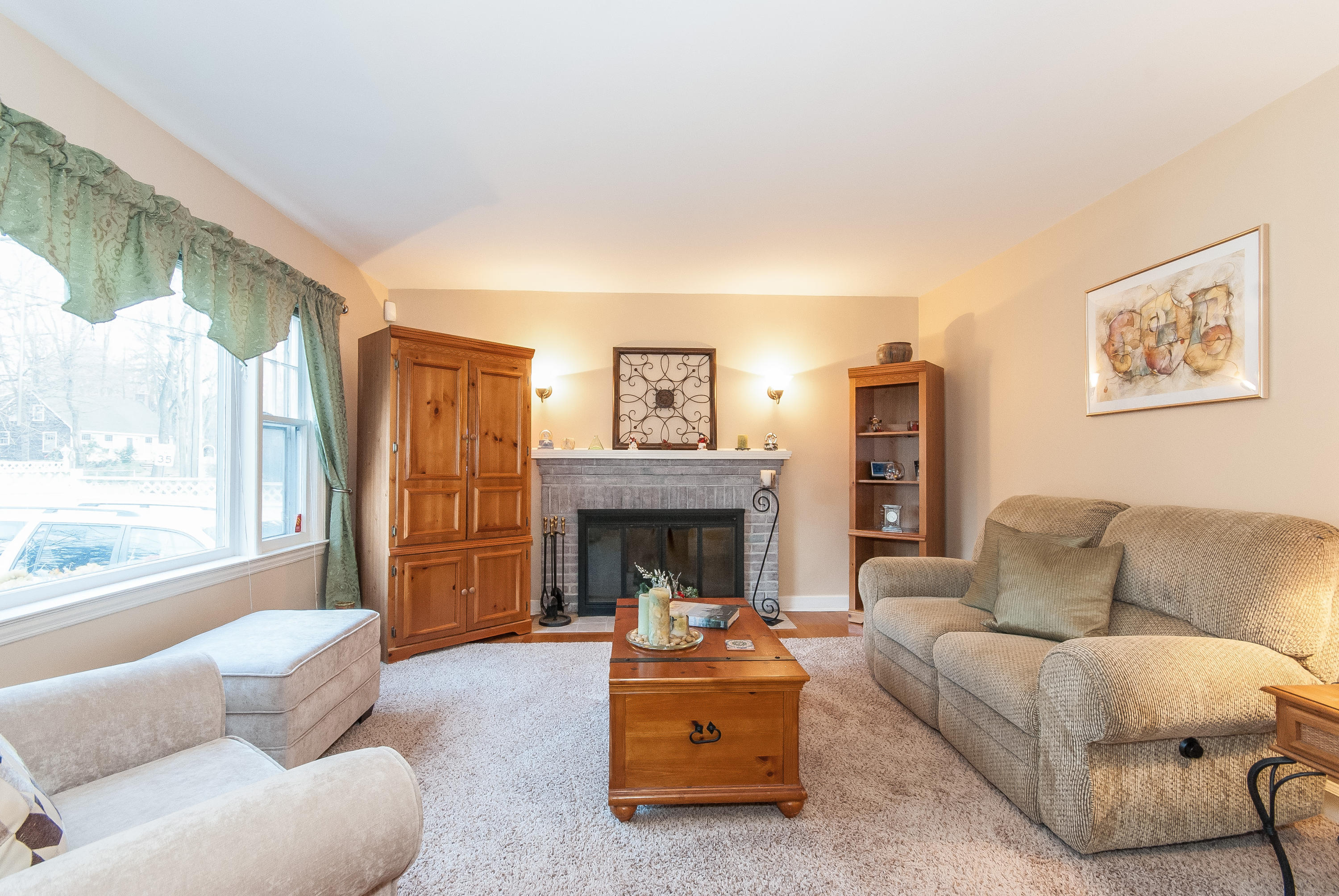 1695 Boston Post Road Darien, CT 06820 - Photo 7 of 20 a living room with furniture and a fireplace