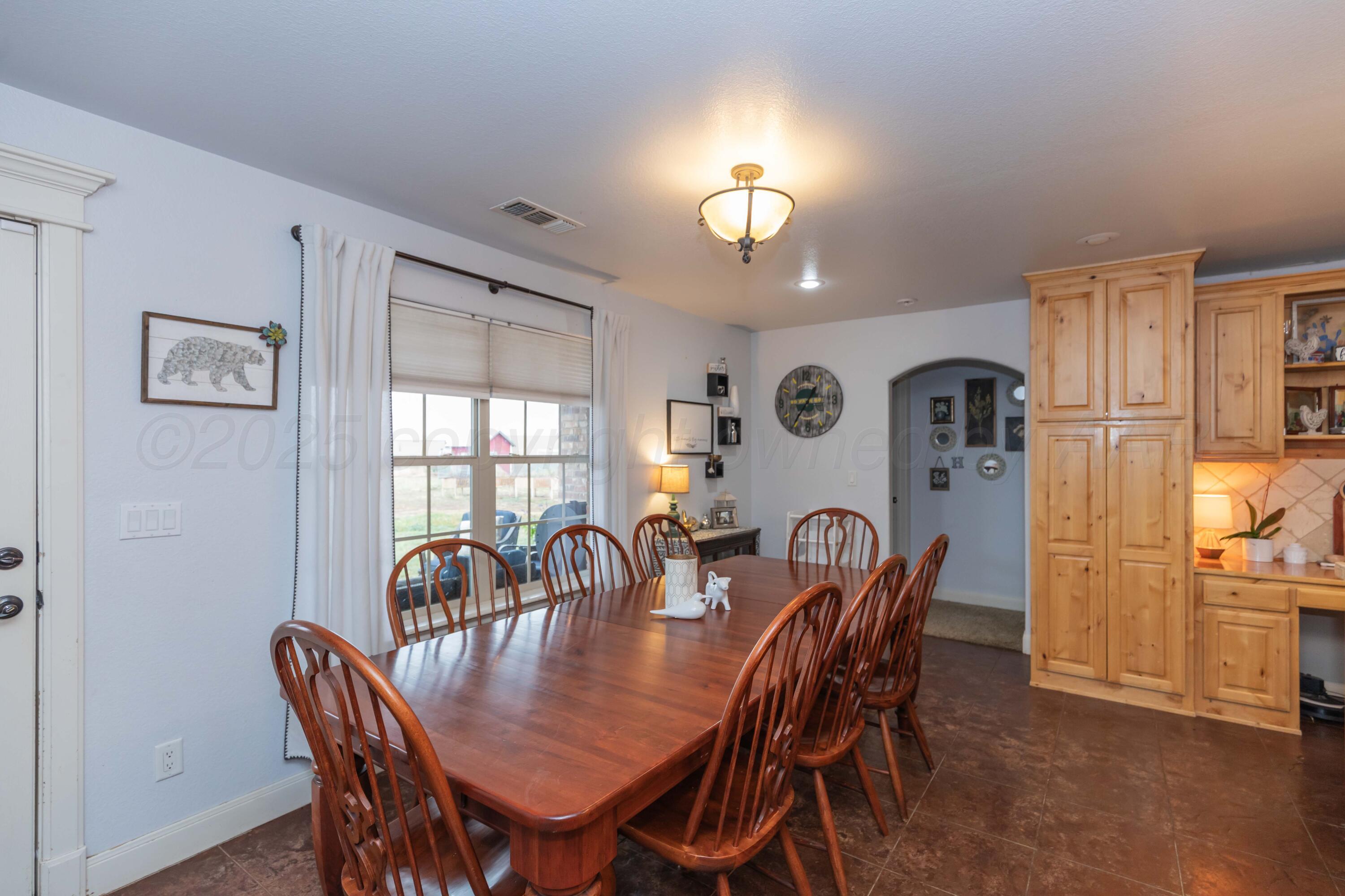 1301 Moon Ridge Lane Amarillo, TX 79124 - Photo 17 of 34 a view of a dining room with furniture and chandelier