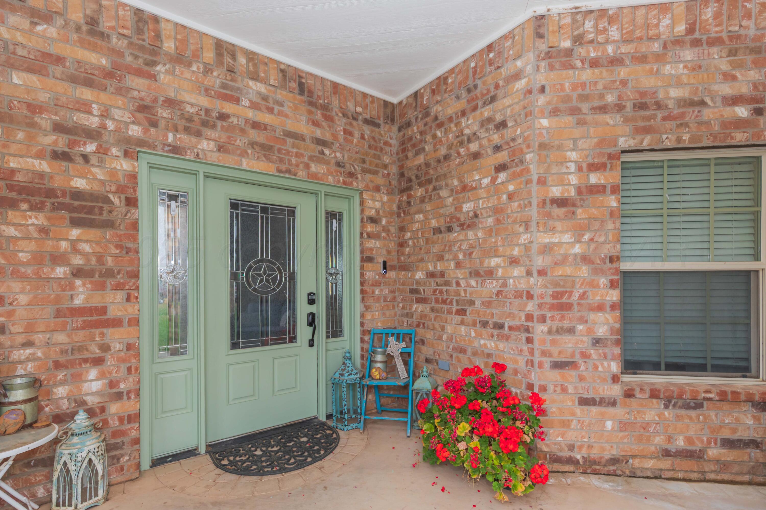 1301 Moon Ridge Lane Amarillo, TX 79124 - Photo 2 of 34 a front view of a house with an outdoor space