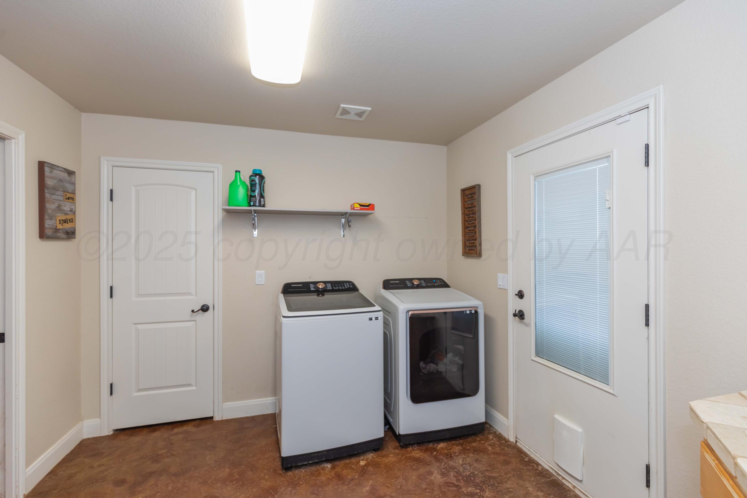 1301 Moon Ridge Lane Amarillo, TX 79124 - Photo 24 of 34 a utility room with dryer and washer
