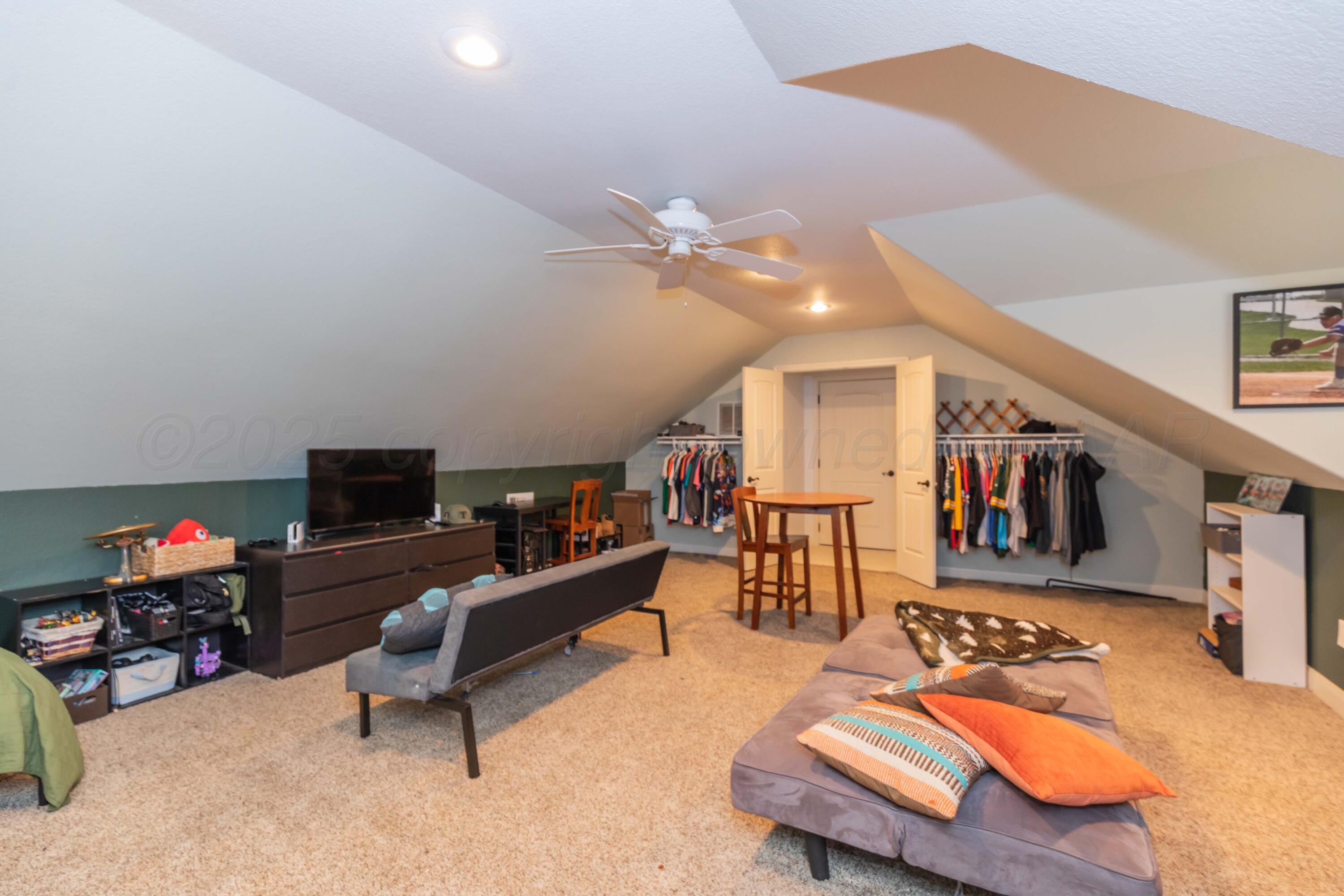 1301 Moon Ridge Lane Amarillo, TX 79124 - Photo 31 of 34 a living room with furniture and a flat screen tv