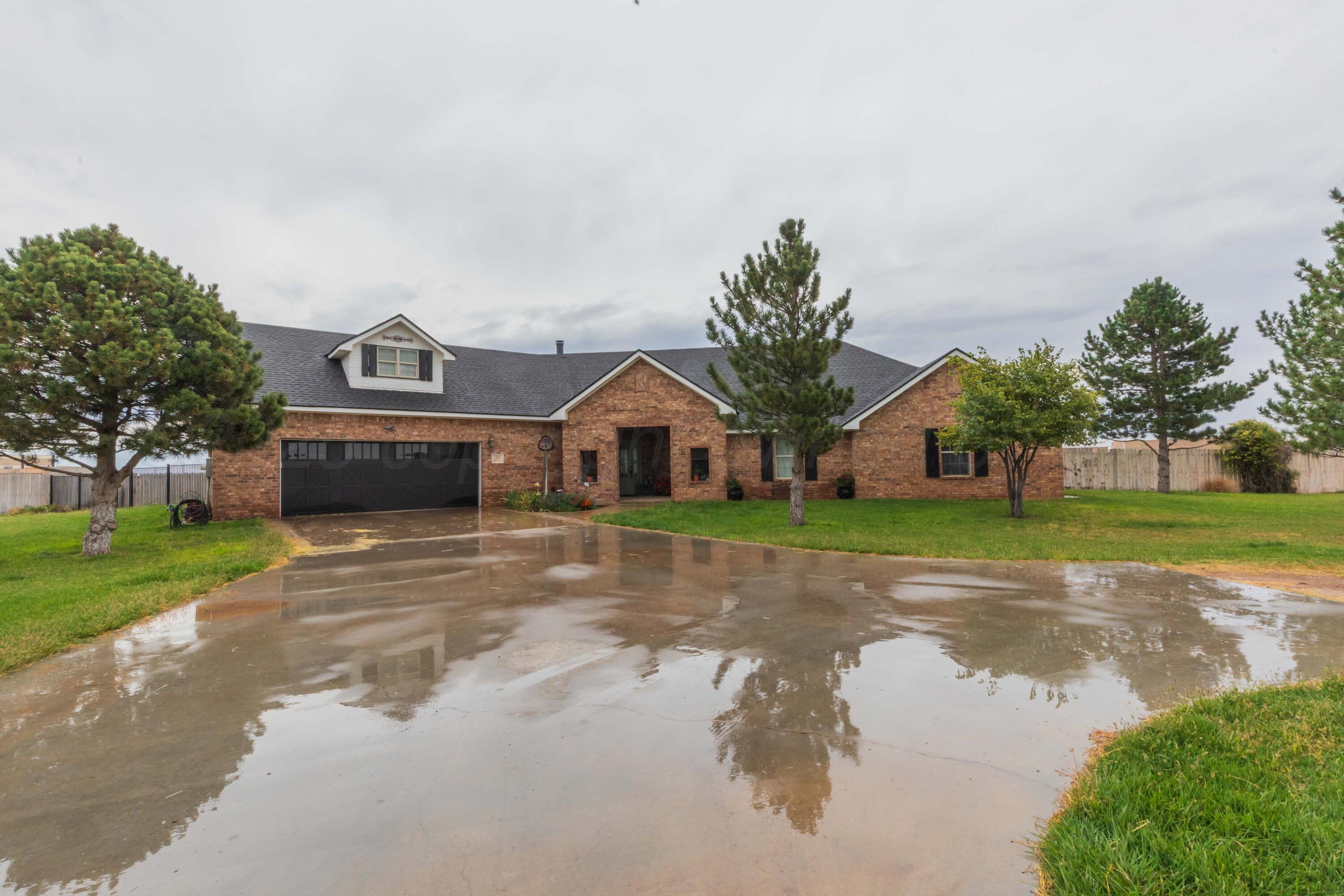 1301 Moon Ridge Lane Amarillo, TX 79124 - Photo 32 of 34 a front view of house with yard and green space