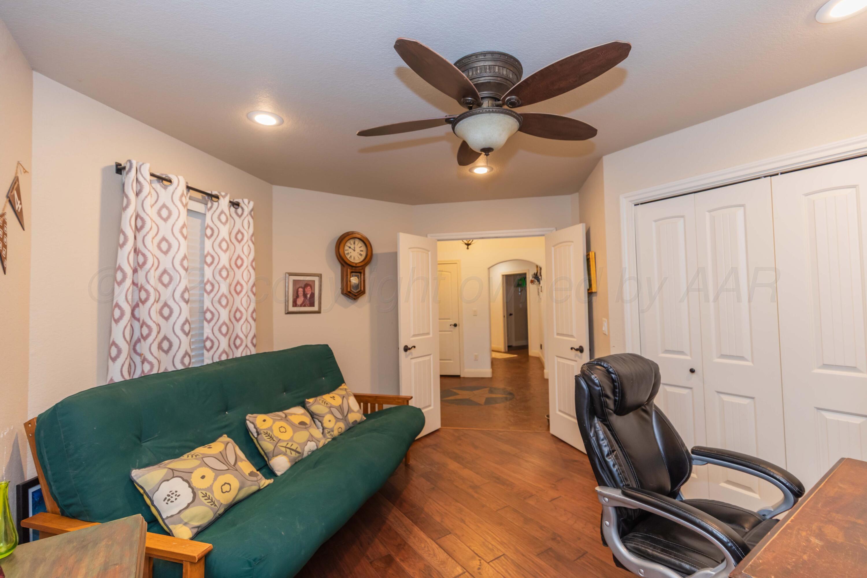 1301 Moon Ridge Lane Amarillo, TX 79124 - Photo 6 of 34 a living room with furniture and a large window