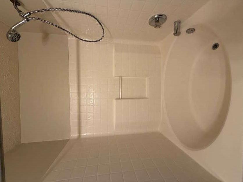 5196 Tew Lane Southwest Covington, GA 30014 - Photo 15 of 41 a bathroom with a shower