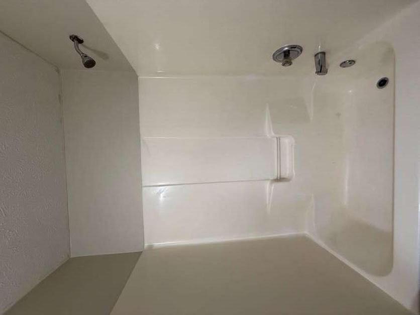 5196 Tew Lane Southwest Covington, GA 30014 - Photo 28 of 41 a bathroom with a bathtub