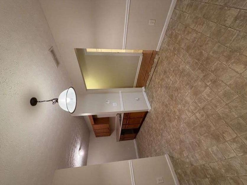 5196 Tew Lane Southwest Covington, GA 30014 - Photo 6 of 41 a view of empty room with a sink and chandelier