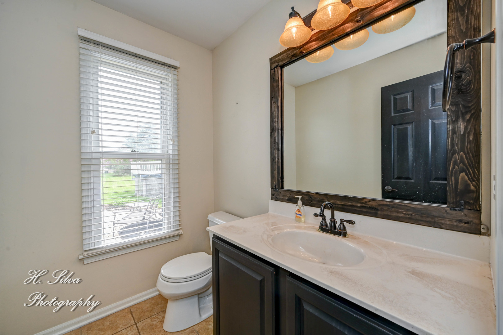 3670 Persimmon Drive Algonquin, IL 60102 - Photo 10 of 13 a bathroom with a granite countertop sink toilet a large mirror and a window
