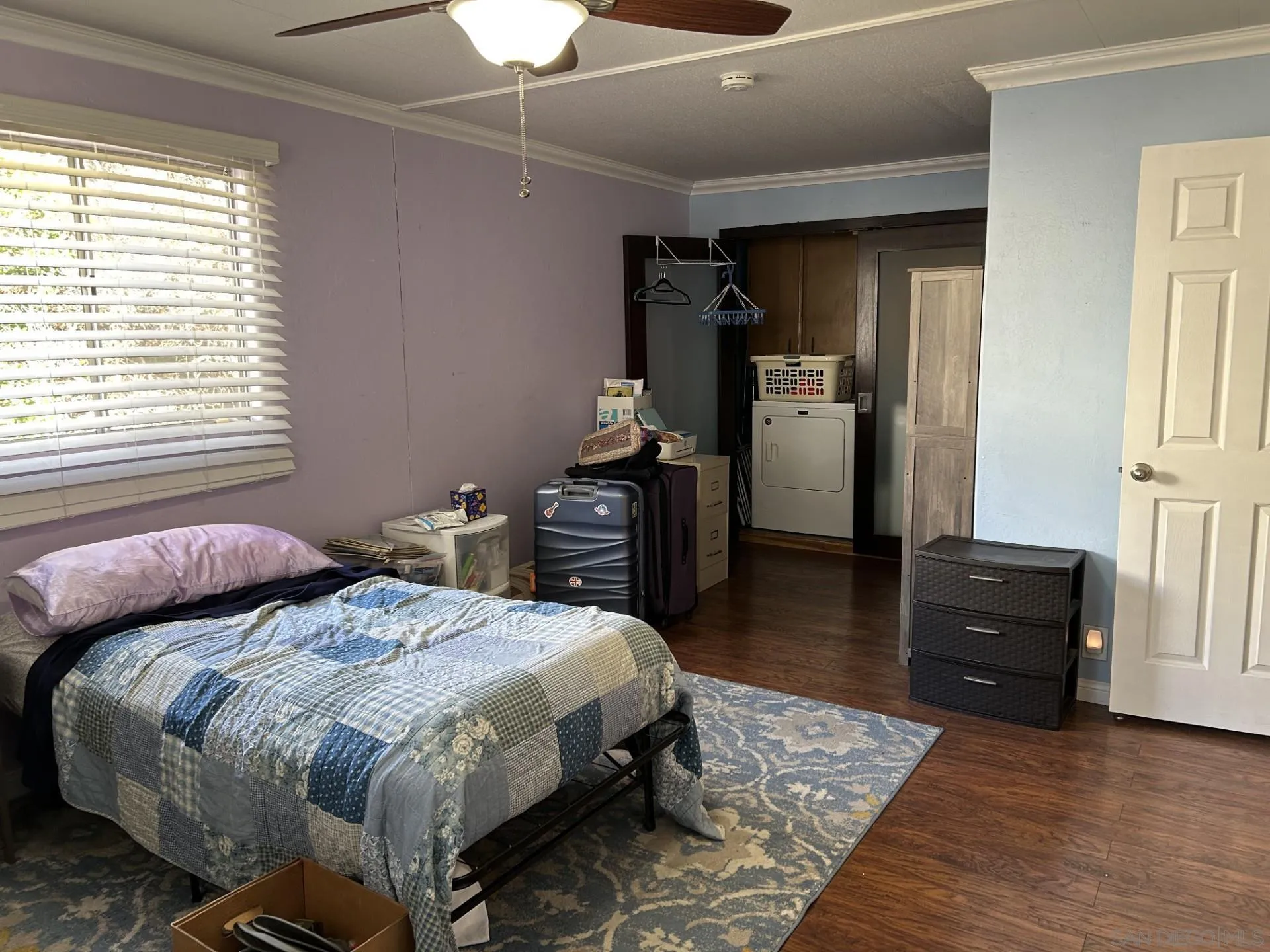 13300 Los Coches Road East, Unit 92 El Cajon, CA 92021 - Photo 11 of 21 a bedroom with a bed and wooden floor