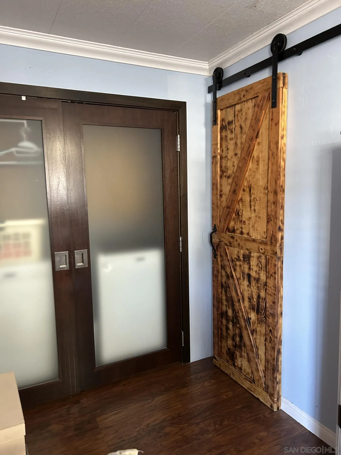 13300 Los Coches Road East, Unit 92 El Cajon, CA 92021 - Photo 12 of 21 a view of empty room with wooden floor and fan
