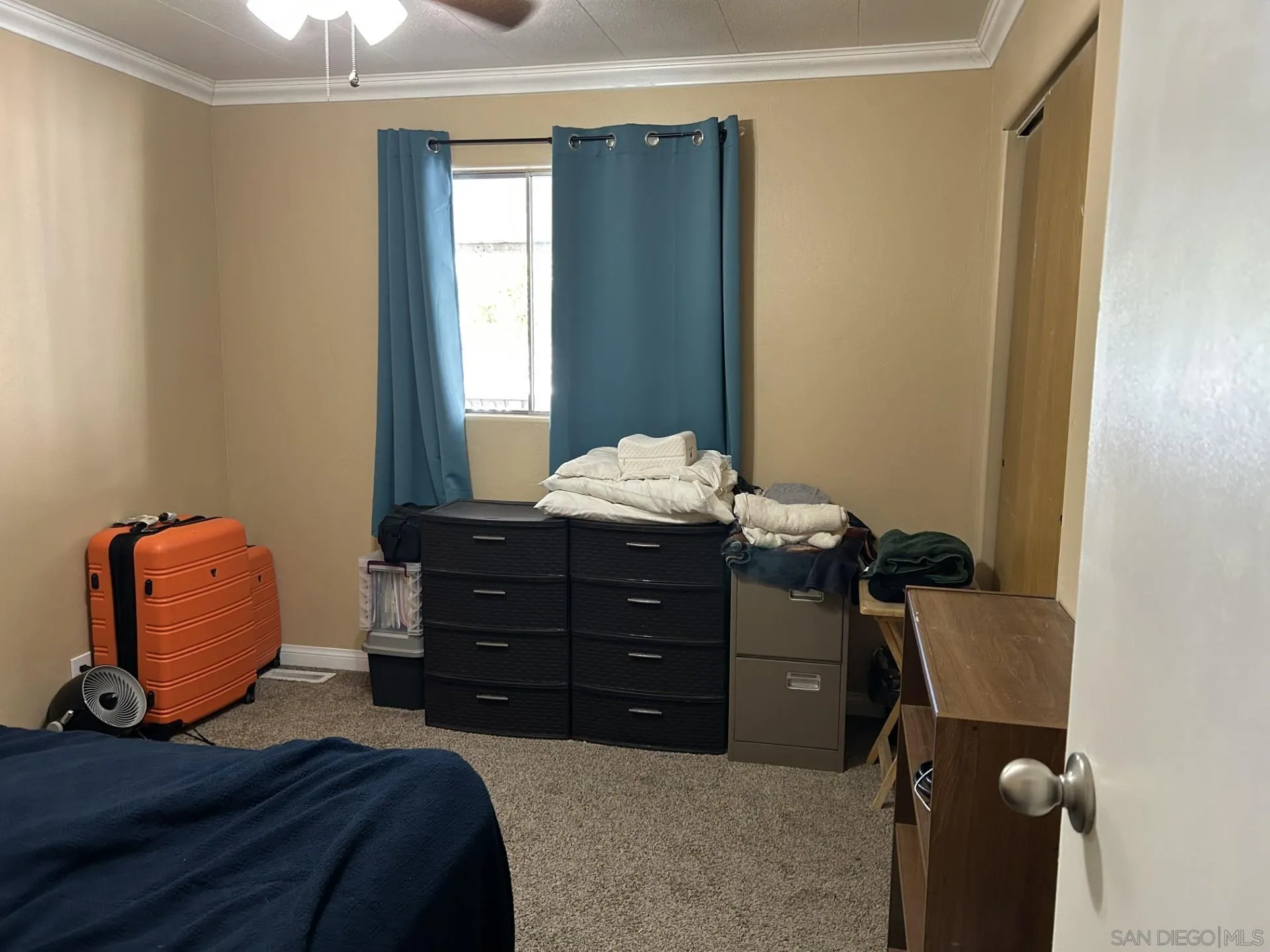 13300 Los Coches Road East, Unit 92 El Cajon, CA 92021 - Photo 18 of 21 a bedroom with a bed and a chair