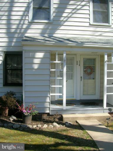 52 Ridge Road, Unit A Greenbelt, MD 20770 - Photo 12 of 22 a view of a entryway door front of a house