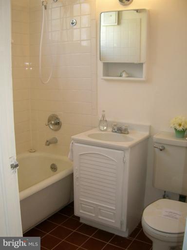 52 Ridge Road, Unit A Greenbelt, MD 20770 - Photo 18 of 22 a bathroom with a sink toilet and shower