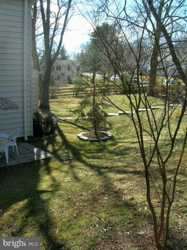 52 Ridge Road, Unit A Greenbelt, MD 20770 - Photo 19 of 22 a view of a yard with large trees