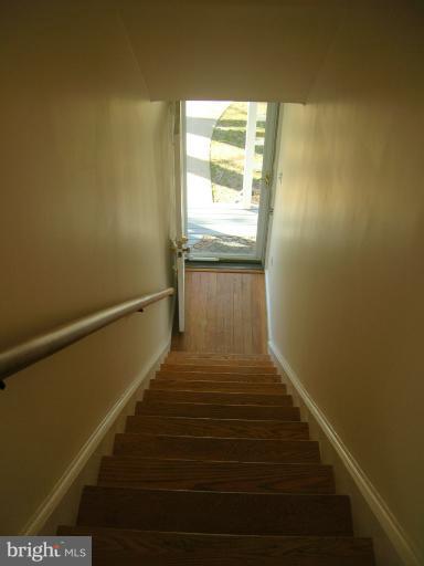 52 Ridge Road, Unit A Greenbelt, MD 20770 - Photo 4 of 22 a view of balcony and wooden floor