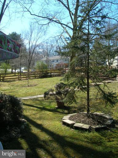 52 Ridge Road, Unit A Greenbelt, MD 20770 - Photo 5 of 22 a view of a playground with large trees