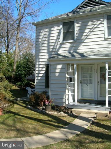 52 Ridge Road, Unit A Greenbelt, MD 20770 - Photo 7 of 22 a view of a house with a yard and sitting area