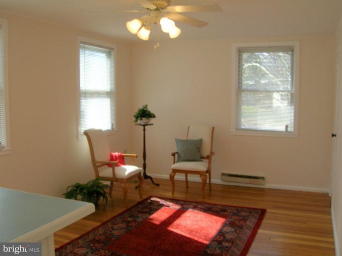 52 Ridge Road, Unit A Greenbelt, MD 20770 - Photo 8 of 22 a living room with furniture and a window