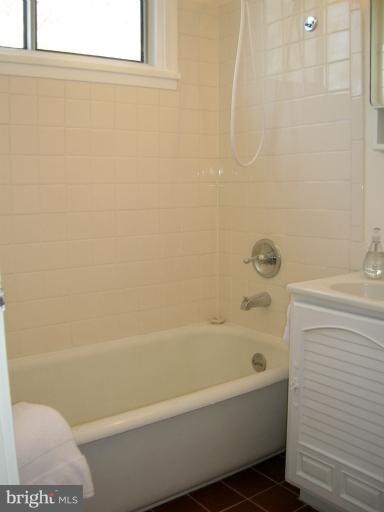52 Ridge Road, Unit A Greenbelt, MD 20770 - Photo 9 of 22 a bathroom with a bathtub and a toilet