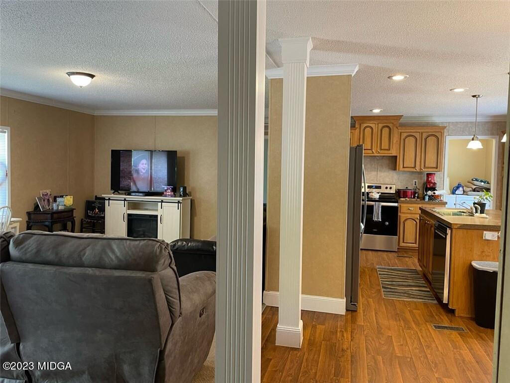1013 Highway 41 Barnesville, GA 30204 - Photo 4 of 13 a living room with furniture and a flat screen tv