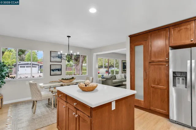 a kitchen with a table and chairs