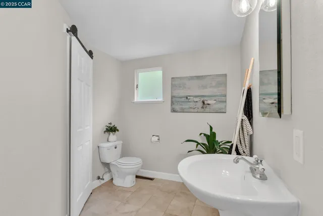 a bathroom with a sink and toilet