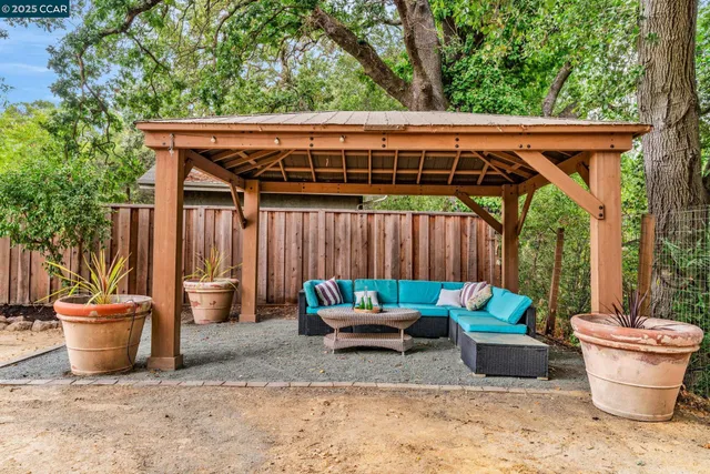 a patio with a patio couch and chairs