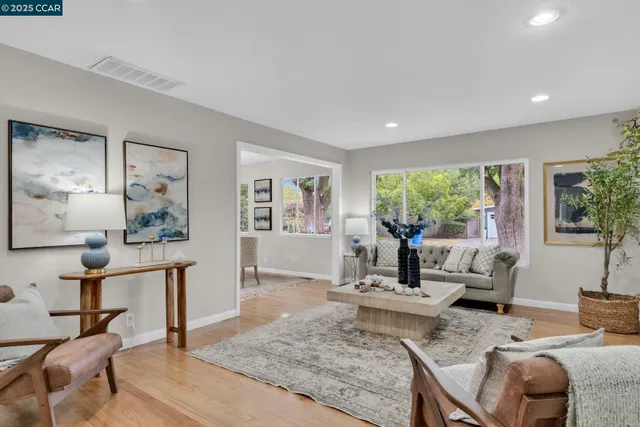 a living room with furniture and a table