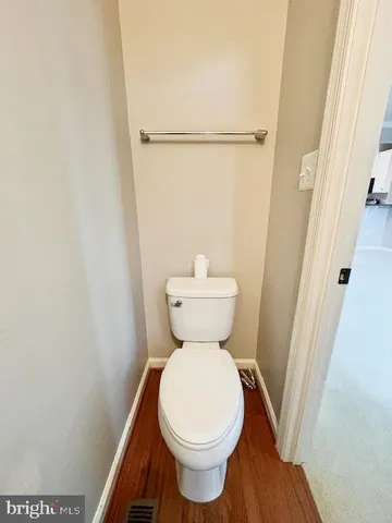 a bathroom with a toilet and a sink