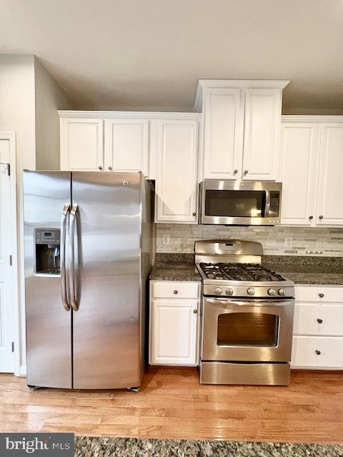 3542 Sprigg Street South Frederick, MD 21704 - Photo 9 of 34 a kitchen with stainless steel appliances granite countertop a stove a refrigerator and a microwave