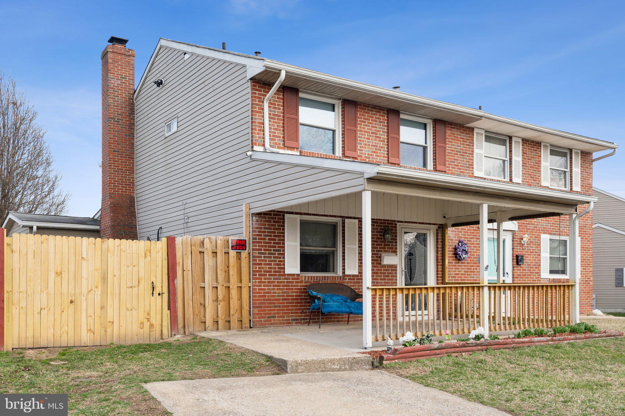 175 Seagull Drive Pasadena, MD 21122 - Photo 1 of 23 a view of a house with a small yard and wooden fence