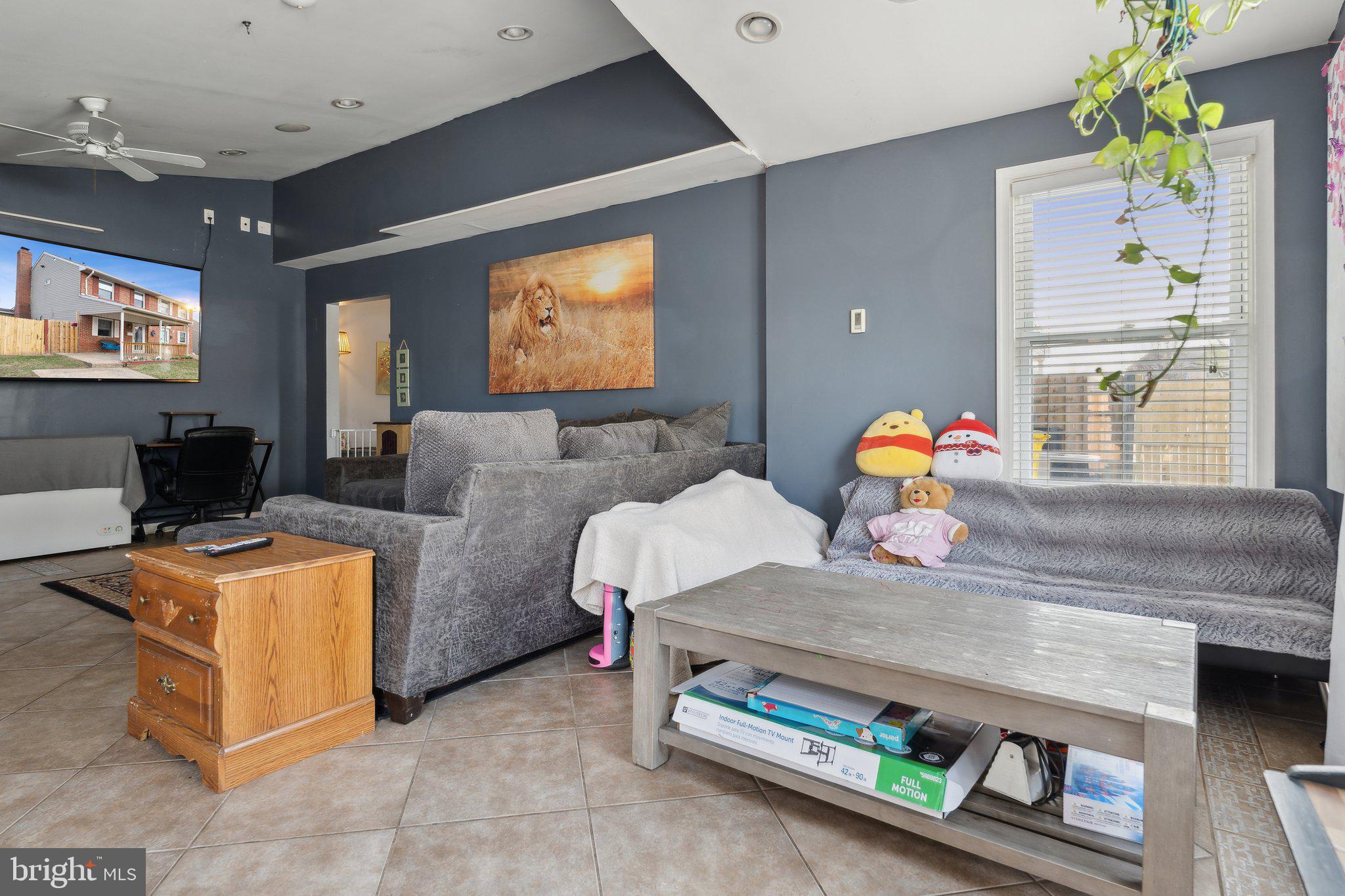 175 Seagull Drive Pasadena, MD 21122 - Photo 12 of 23 a living room with furniture and a flat screen tv