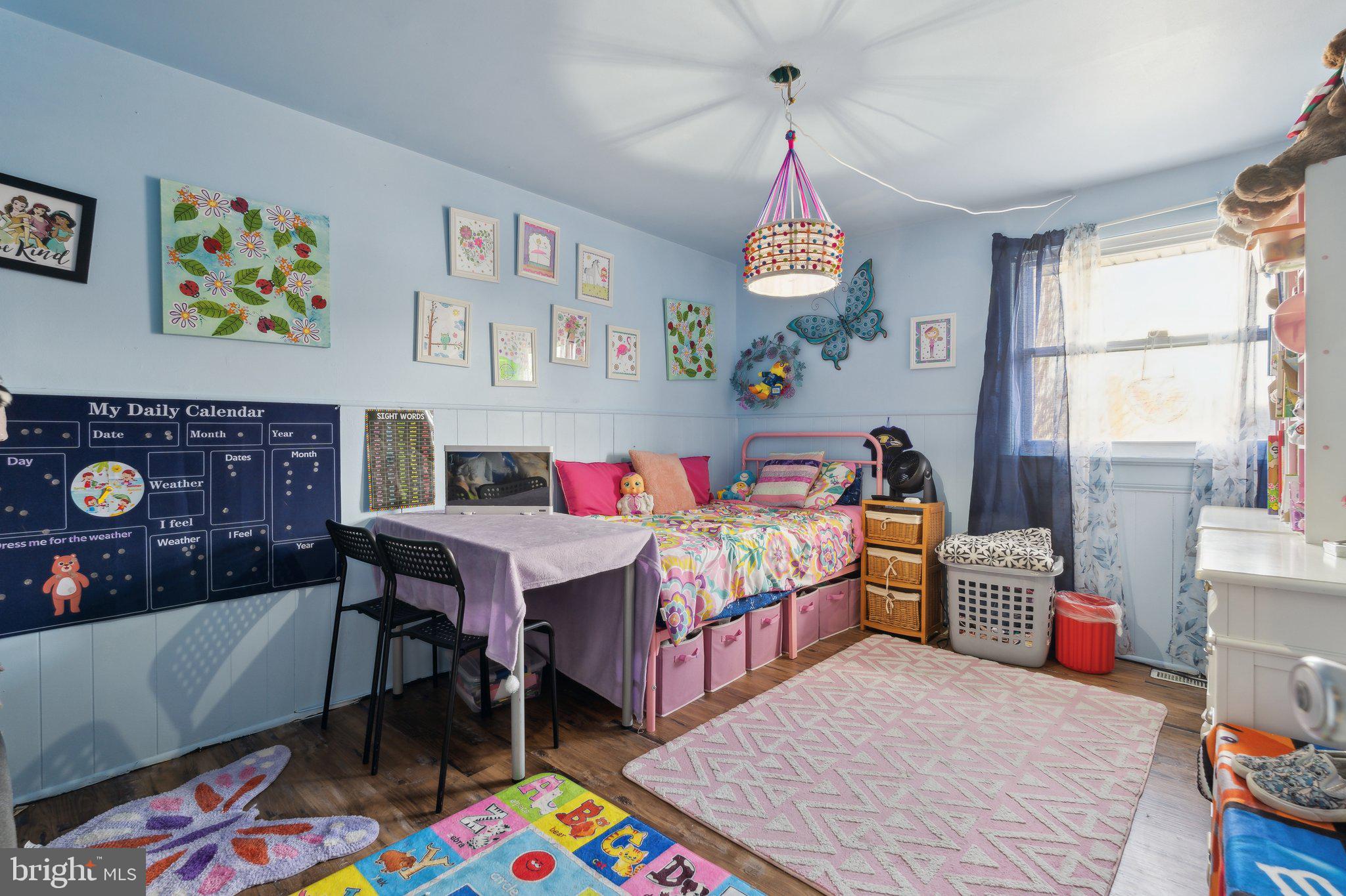175 Seagull Drive Pasadena, MD 21122 - Photo 17 of 23 a bedroom with a bed a computer on desk and a window