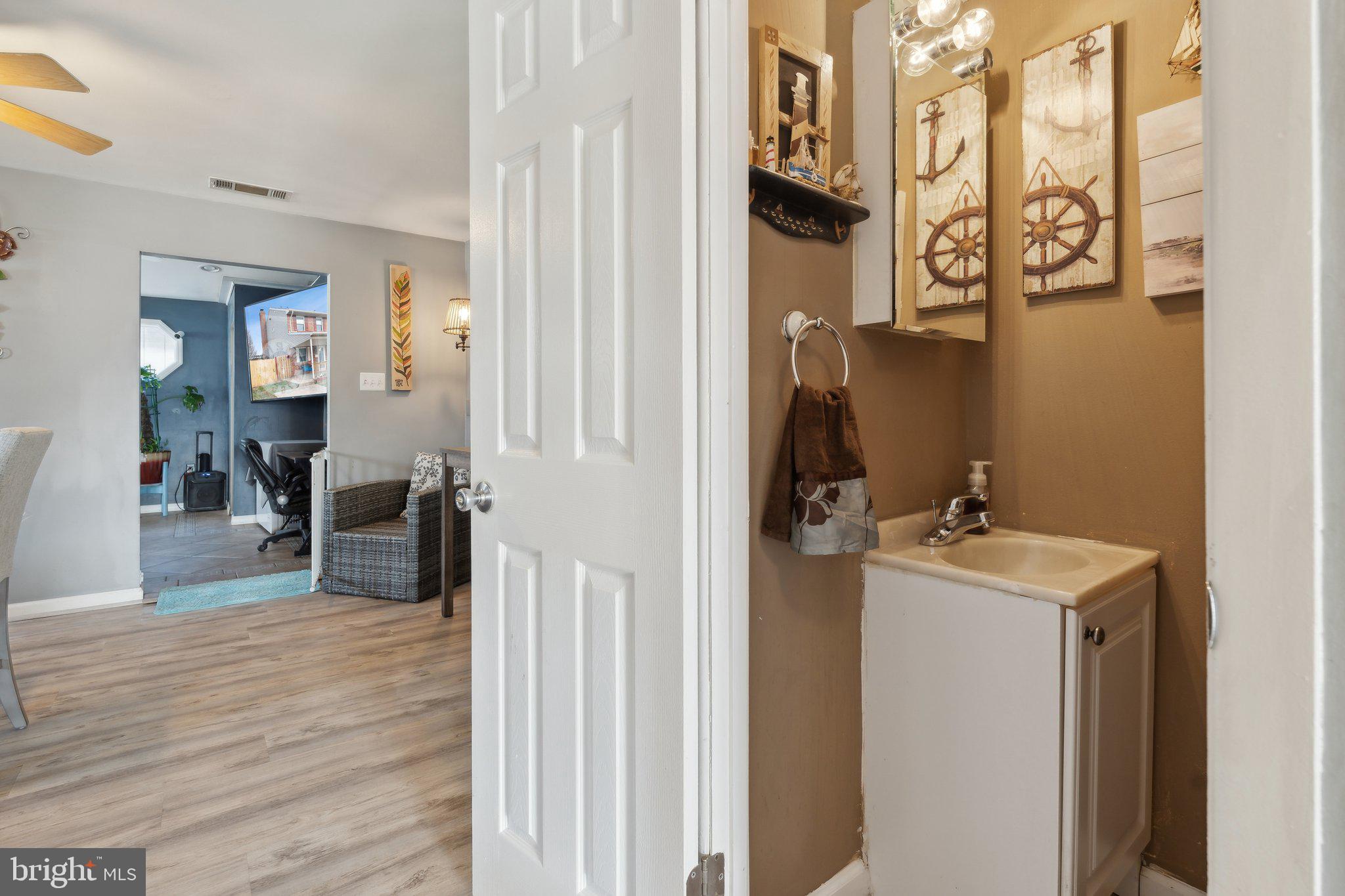 175 Seagull Drive Pasadena, MD 21122 - Photo 8 of 23 a bathroom with a sink and mirror