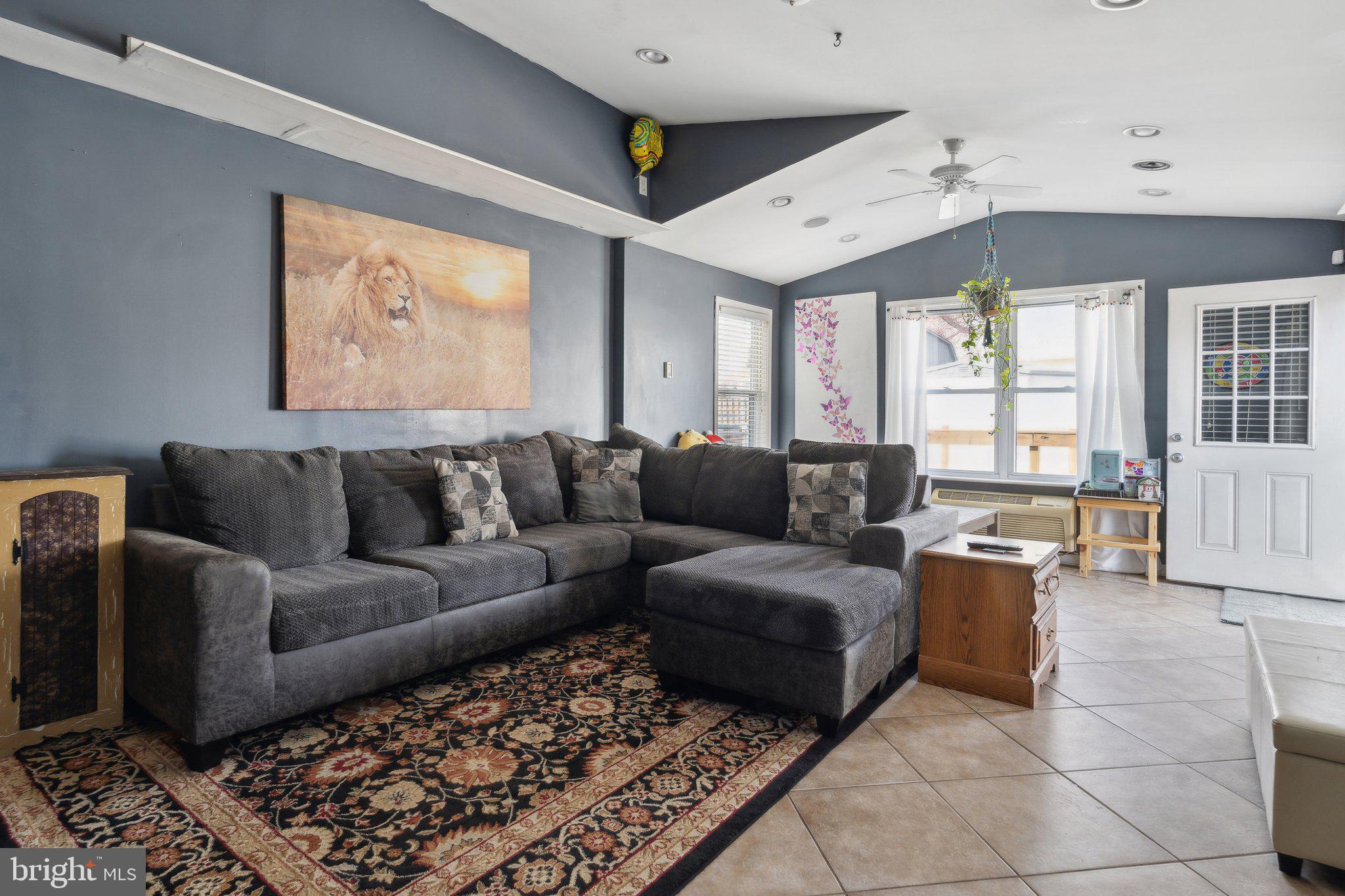 175 Seagull Drive Pasadena, MD 21122 - Photo 9 of 23 a living room with furniture and a large window
