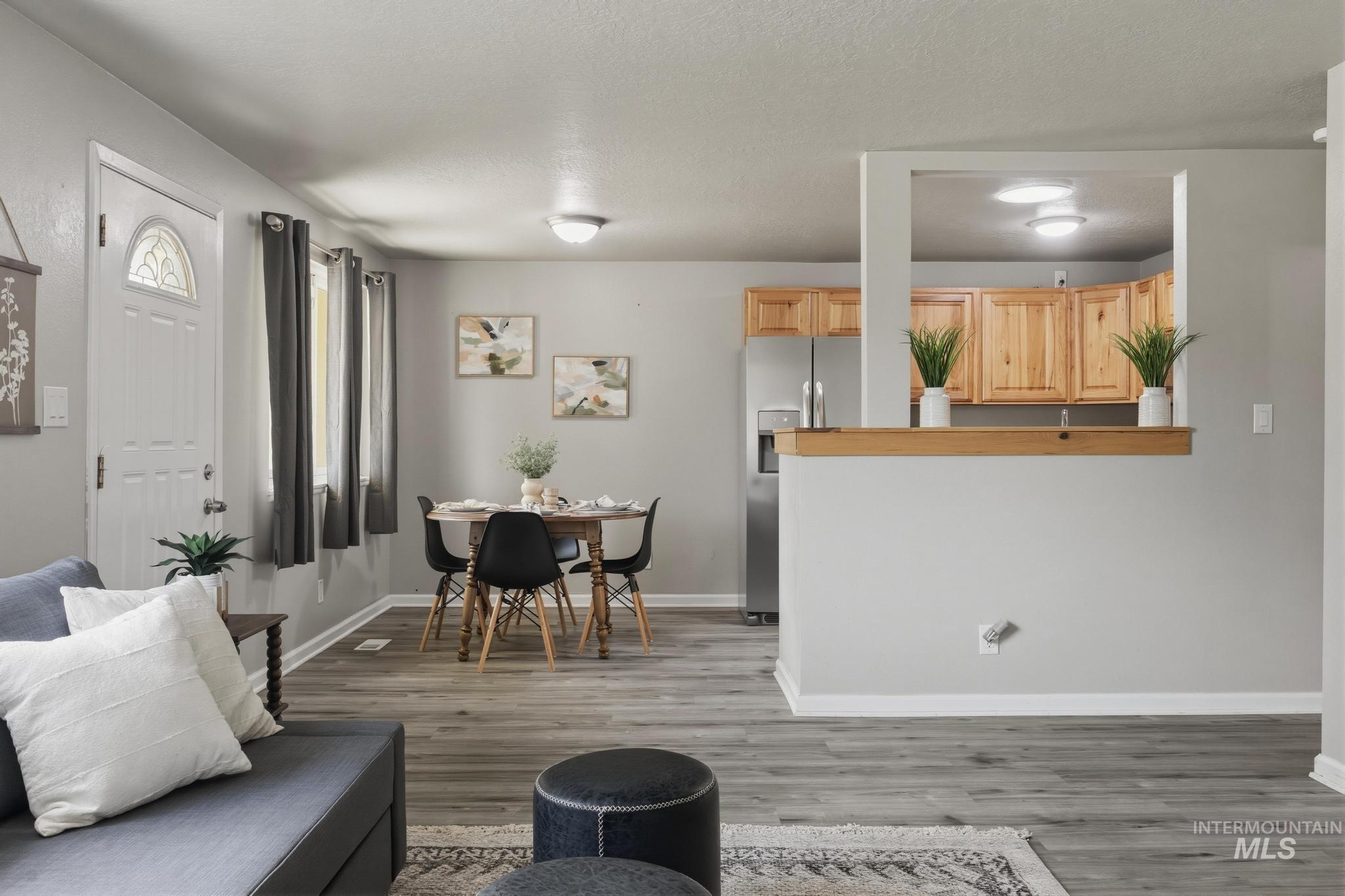 3040 West Hester Street Boise, ID 83702 - Photo 5 of 20 Living area featuring wood-finish flooring and light gray wall color