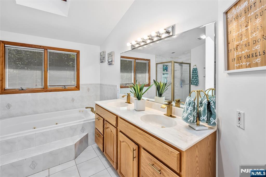 21 Marcia Road Ringwood, NJ 07456 - Photo 18 of 42 a bathroom with a sink and a bathtub