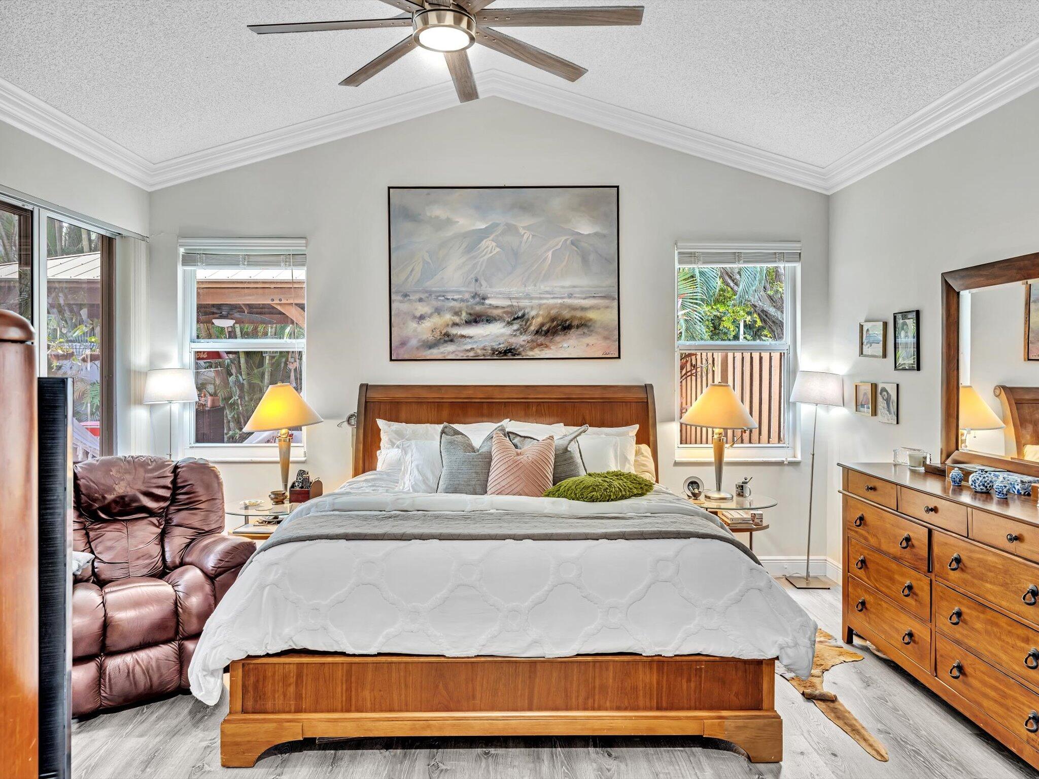 2486 Northwest 66th Drive Boca Raton, FL 33496 - Photo 12 of 80 a bedroom with a bed and wooden floor