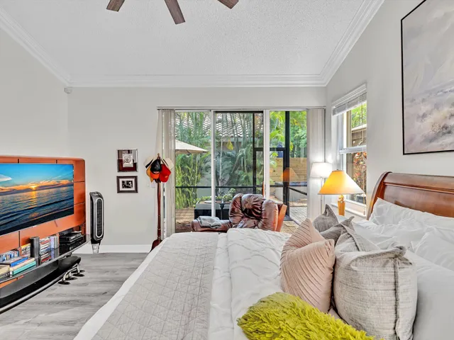 a view of a livingroom with furniture and cars