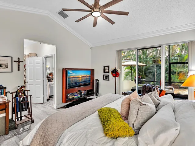 a view of walk in closet with clothes