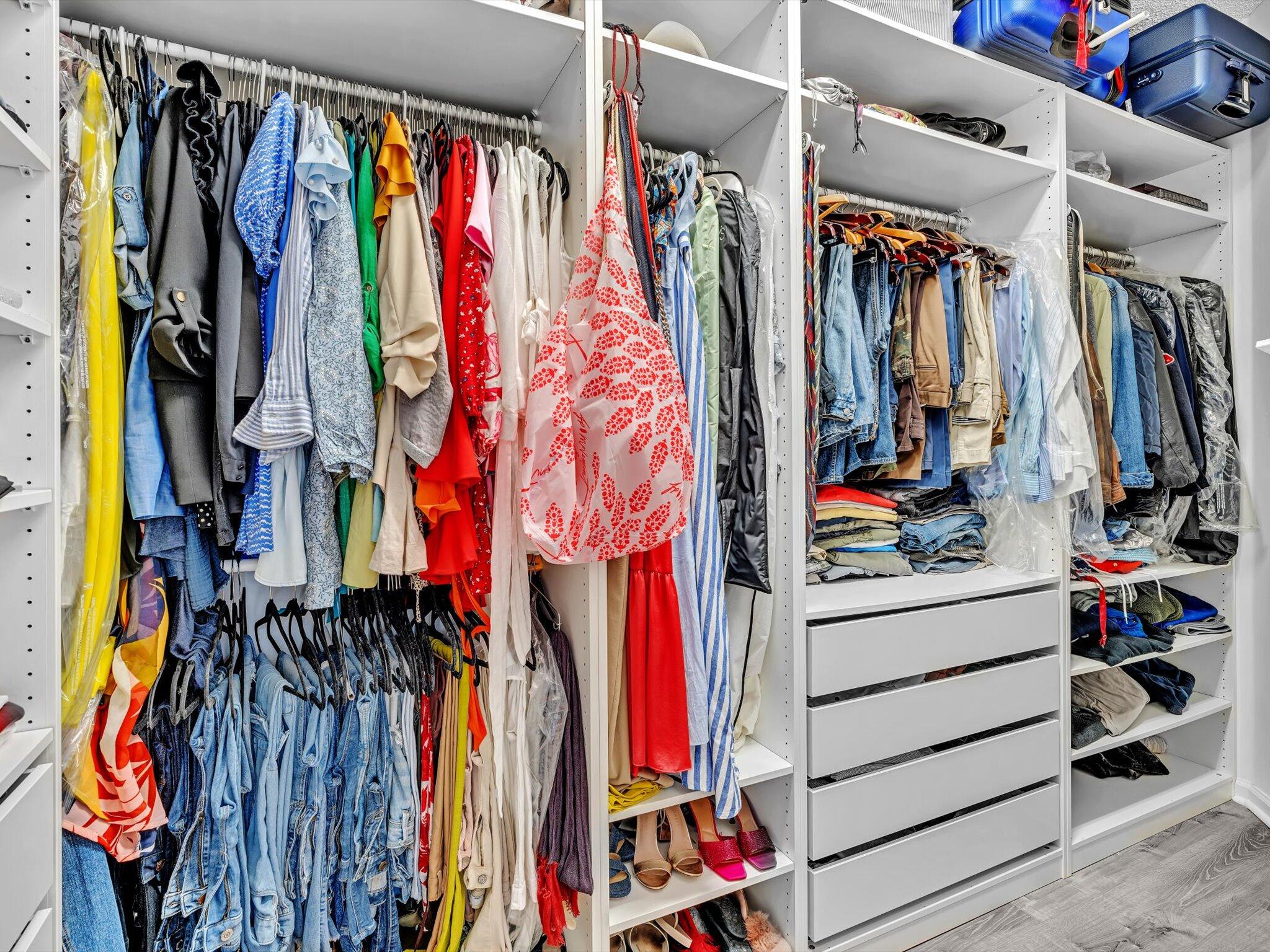 2486 Northwest 66th Drive Boca Raton, FL 33496 - Photo 16 of 80 a view of walk in closet with clothes
