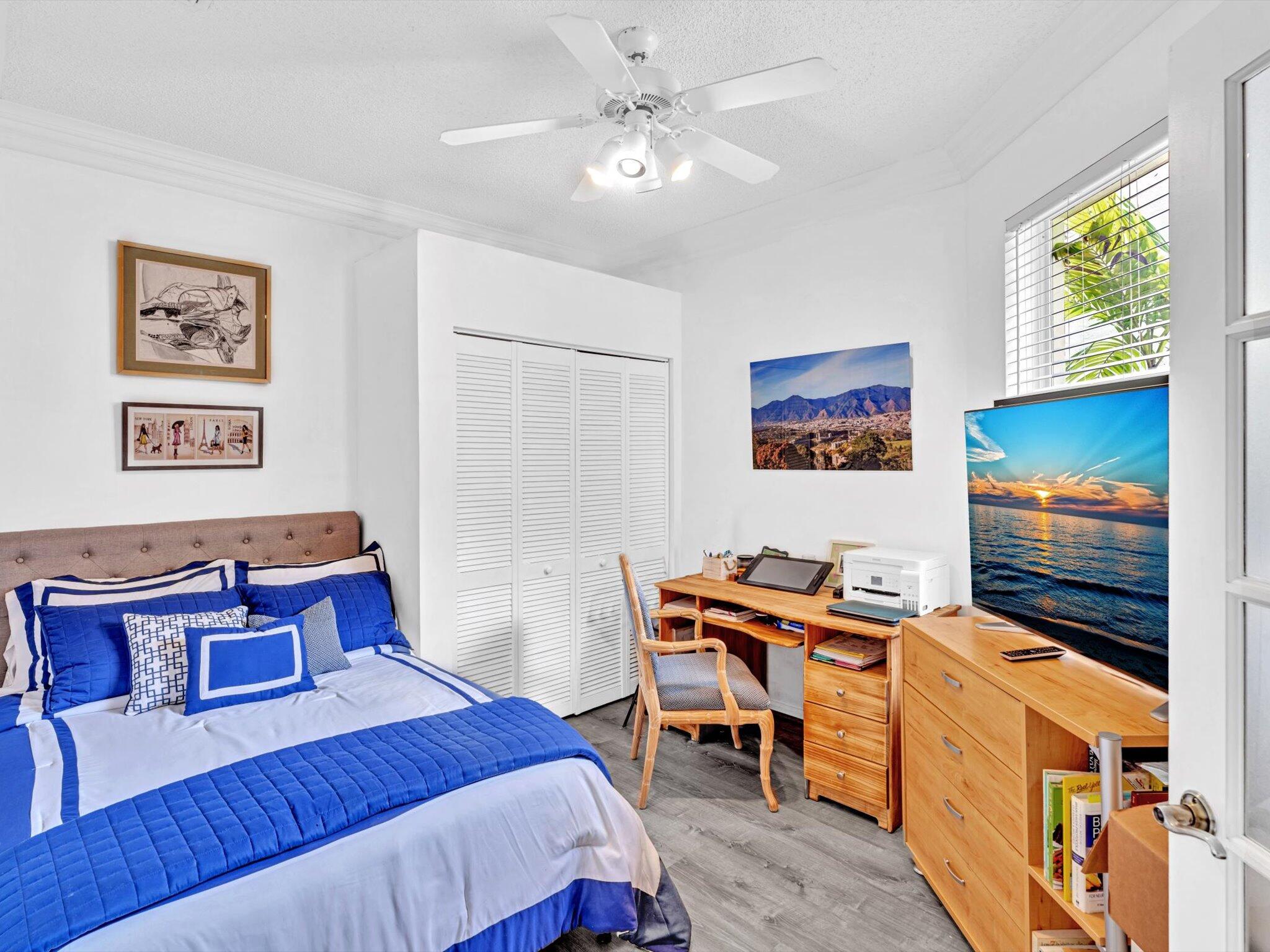 2486 Northwest 66th Drive Boca Raton, FL 33496 - Photo 22 of 80 a bedroom with furniture and a window