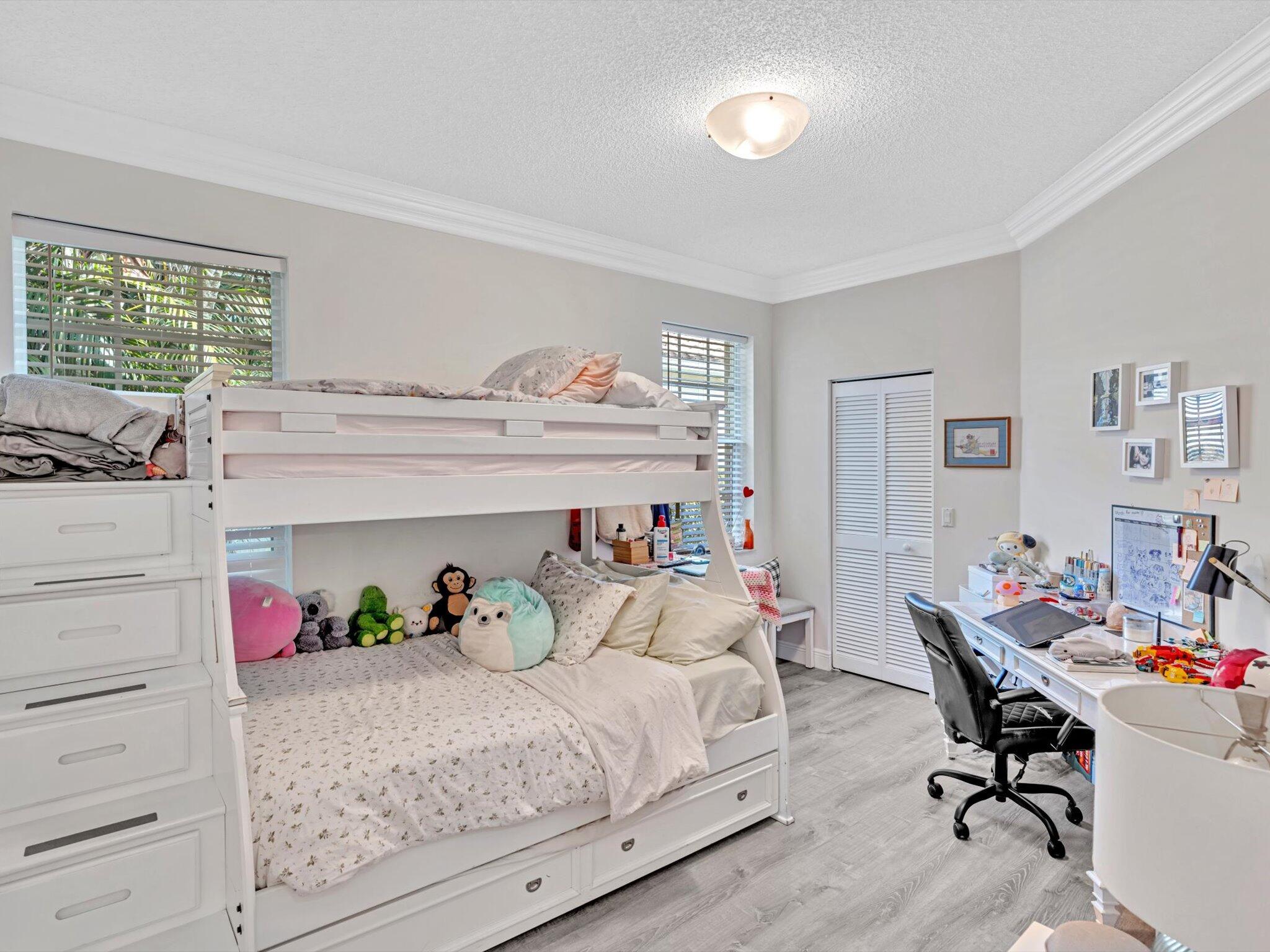 2486 Northwest 66th Drive Boca Raton, FL 33496 - Photo 24 of 80 a bedroom with furniture and a window