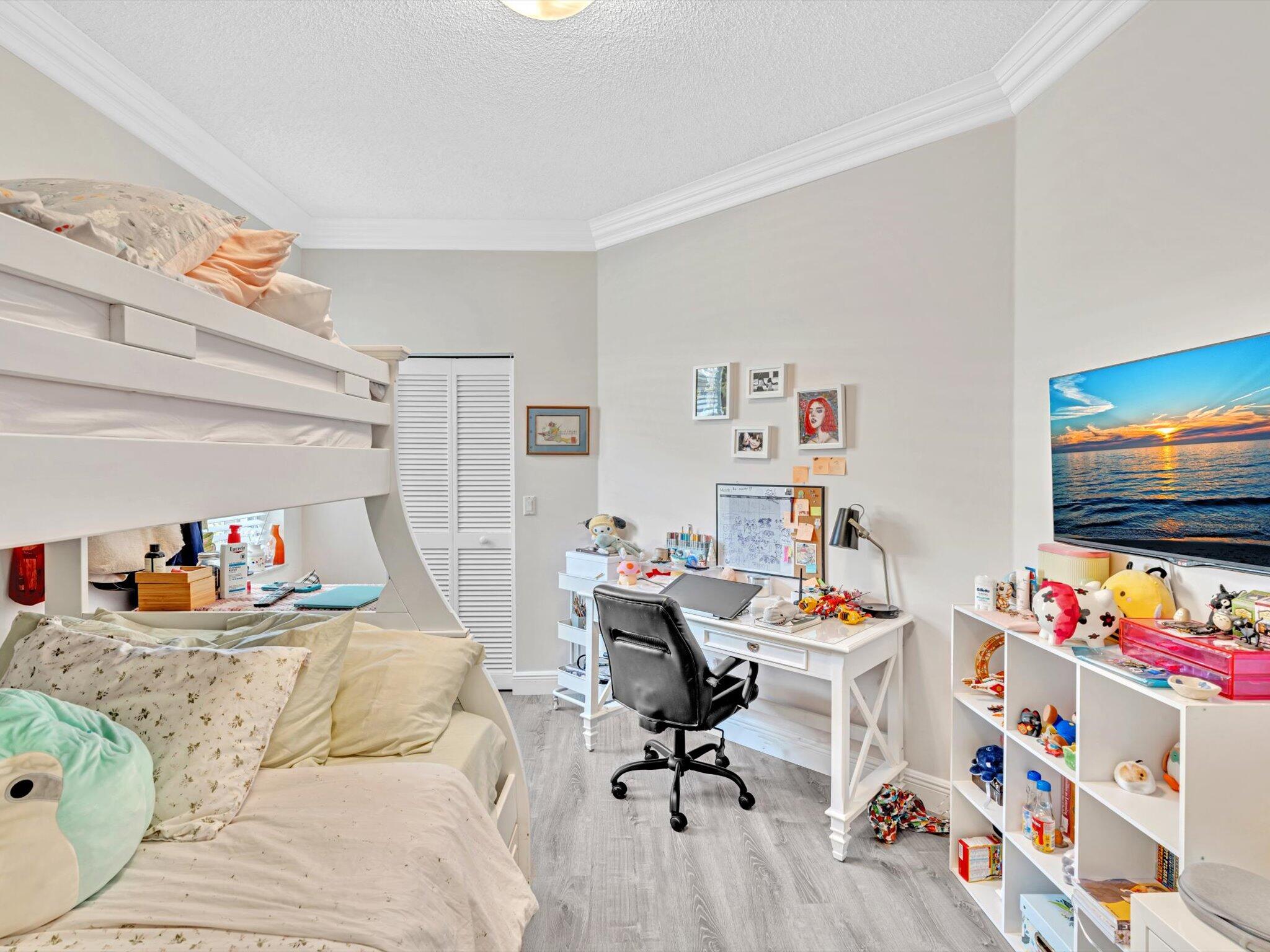 2486 Northwest 66th Drive Boca Raton, FL 33496 - Photo 25 of 80 a living room with furniture and a flat screen tv