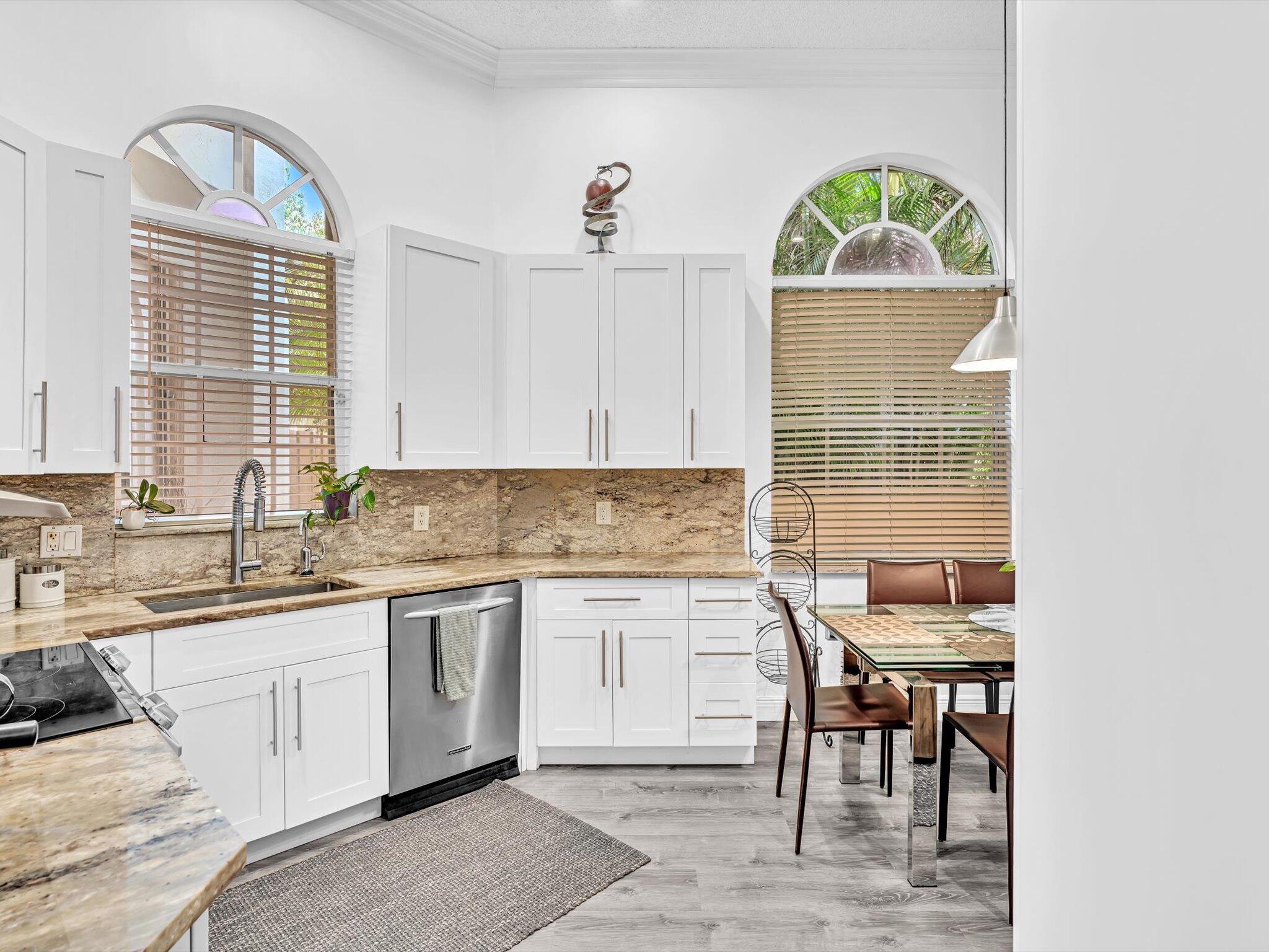 2486 Northwest 66th Drive Boca Raton, FL 33496 - Photo 29 of 80 a kitchen with a sink cabinets and window