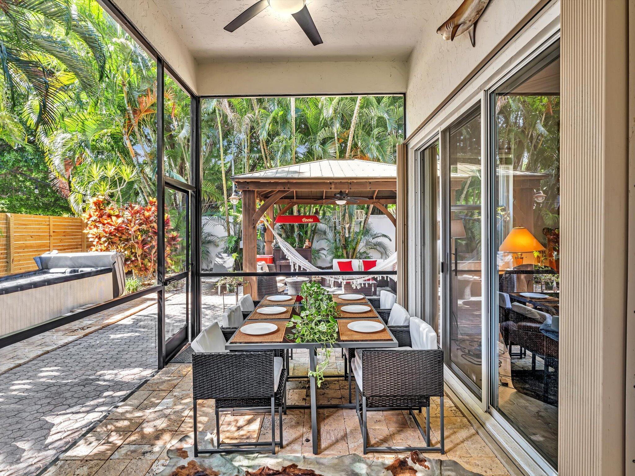 2486 Northwest 66th Drive Boca Raton, FL 33496 - Photo 34 of 80 a outdoor living space with furniture and garden view